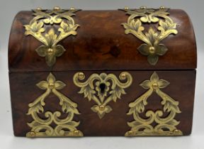 Victorian burr walnut brass bound domed topped casket containing two glass scent bottles and