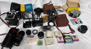 A collection of cameras, lenses and photography equipment to include Coronet Popular Twelve,