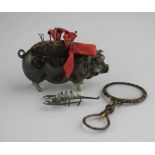 A silver pin cushion modelled as a standing pig Birmingham 1929, together with a gilt metal spy
