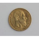 A Leopold II 20 Francs gold coin dated 1874