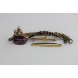 A 9ct gold plain bar brooch, a 9ct gold and seed pearl brooch with a swallow motif, Chester 1906,