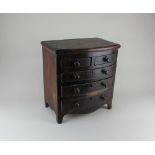 A 19th century miniature mahogany bowfront chest of two short over three long graduated drawers,