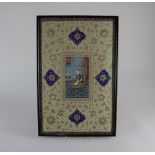 A framed Indian gouache painting of a figure seated on a throne, with gilt embellishments, 43cm by