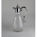 A Victorian silver plate mounted glass claret jug with dome lid and scroll handle, the glass