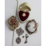 A gilt filigree and amethyst two stone pendant collet set with two oval cut amethysts, with a neck