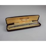 A cased Yard O Led silver retractable pencil with paper instructions, hallmarked London 1950, 12.
