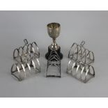 A set of four Edward VIII silver toastracks maker Walker and Hall, Birmingham 1936, another George V