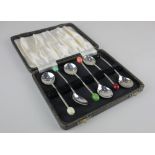 A cased set of six George VI silver coffee spoons each with a different colour bean terminal,