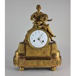 A 19th century French Empire ormolu bronze mantle clock with a seated figure and putto resting on