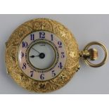 A gold cased keyless wind half hunting cased lady's fob watch with an unsigned gilt jeweled lever
