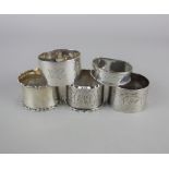 Five various silver napkin rings each with engraved initials, 4.4oz