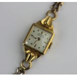 A Rolex Precision 18ct gold shaped rectangular cased lady's wristwatch the jewelled movement