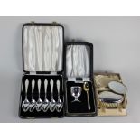 A cased set of six Queen Elizabeth II silver grapefruit spoons maker Viners, Sheffield 1960, a cased