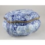 A Dutch bombe shaped blue and white box, decorated with panels of classical scenes and landscapes,