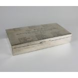 An Indian rectangular silver cigarette box with engraved presentation to lid, wood lined interior,