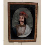 A framed reverse glass painting of a Mughal type figure 50cm by 34.5cm