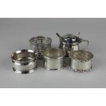 A George V silver mustard pot, maker Ernest W Haywood, Birmingham 1931, and three various silver