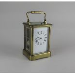 A French repeater brass carriage clock white enamel dial with Roman numerals, 18.5cm