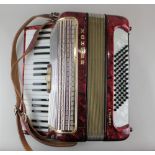 A Hohner Arietta I piano accordion, cased, together with a Notenstander music stand, boxed and