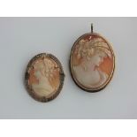A gold mounted oval shell cameo pendant brooch carved as the portrait of a lady, indistinctly marked