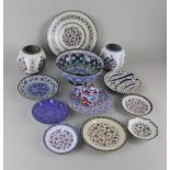 A collection of painted enamel dishes, plates and vases etc, to include two with calligraphy,