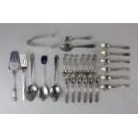 Two sets of six Eastern silver cruet spoons an 880 silver cake slice and other various silver spoons
