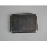 A George V silver cigarette case rectangular curved form with engine turned decoration, and engraved