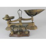 A set of brass letter scales with three weights, together with a set of W&T Avery Ltd scales with