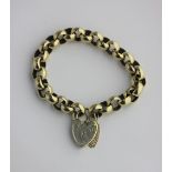 A gold circular link bracelet on a gold heart shaped padlock clasp, bears inscription and date 1996,