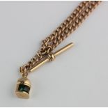 A gold curb link watch Albert chain the links detailed 9c, and fitted with one 15ct gold swivel, a