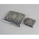 A sterling silver card case scroll decorated with two lions rampant and central engraved initial,