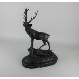 After Pierre-Jules Mene, a bronze model of a stag,on black marble base, 46cm high