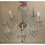 A glass eight light chandelier light fitting, with hanging glass swags and droplets (a/f)