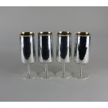 A set of four 20th century silver goblets cylindrical form with gilt interiors, on knopped stems and