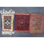 Three various prayer rugs, to include a tribal rug decorated with repeat pattern on red ground
