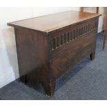 A small oak coffer with carved frieze and block feet, 92cm