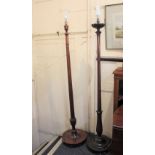 A mahogany reeded column standard lamp on circular base, and another similar standard lamp with