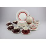 A collection of Susie Cooper tea and coffee wares, to include a striped coffee pot, two teacups