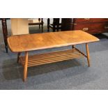 An Ercol coffee table rounded rectangular top with undershelf, 105cm