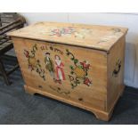 A painted pine mule chest decorated with flowers and figures, with side handles and base drawer on