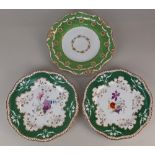 A pair of Spode Felspar porcelain plates, with floral decoration within green and gilt border