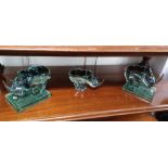 A pair of Swaziland Ngwenya green glass bookends formed as rhinoceroses, 15cm high, and a Ngwenya
