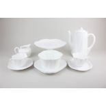 A Shelley 'Dainty' pattern white china part tea service comprising teapot, two teacups and