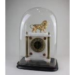 A French gilt metal and onyx mantle clock, surmounted with a lion above a circular dial with open