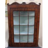 A George III mahogany corner cupboard with glazed panel door enclosing three shelves, width 68cm,