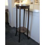 A mahogany jardiniere stand with circular top and undershelf, (a/f) height 99cm