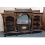 A Victorian gilt metal mounted figured walnut and ebonised breakfront credenza, with central