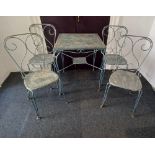 A silver painted metal garden table and four chairs, the square table with pierced patterned top