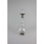 An Edwardian silver mounted glass decanter, maker Norton & White, Birmingham 1905, together with a