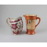 Two Crown Ducal ware jugs; one with borders of pink floral and geometric decoration and gilt